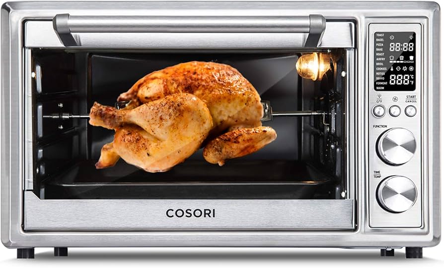 Stainless steel air fryer toaster oven with digital controls, baking a pizza on the rack.