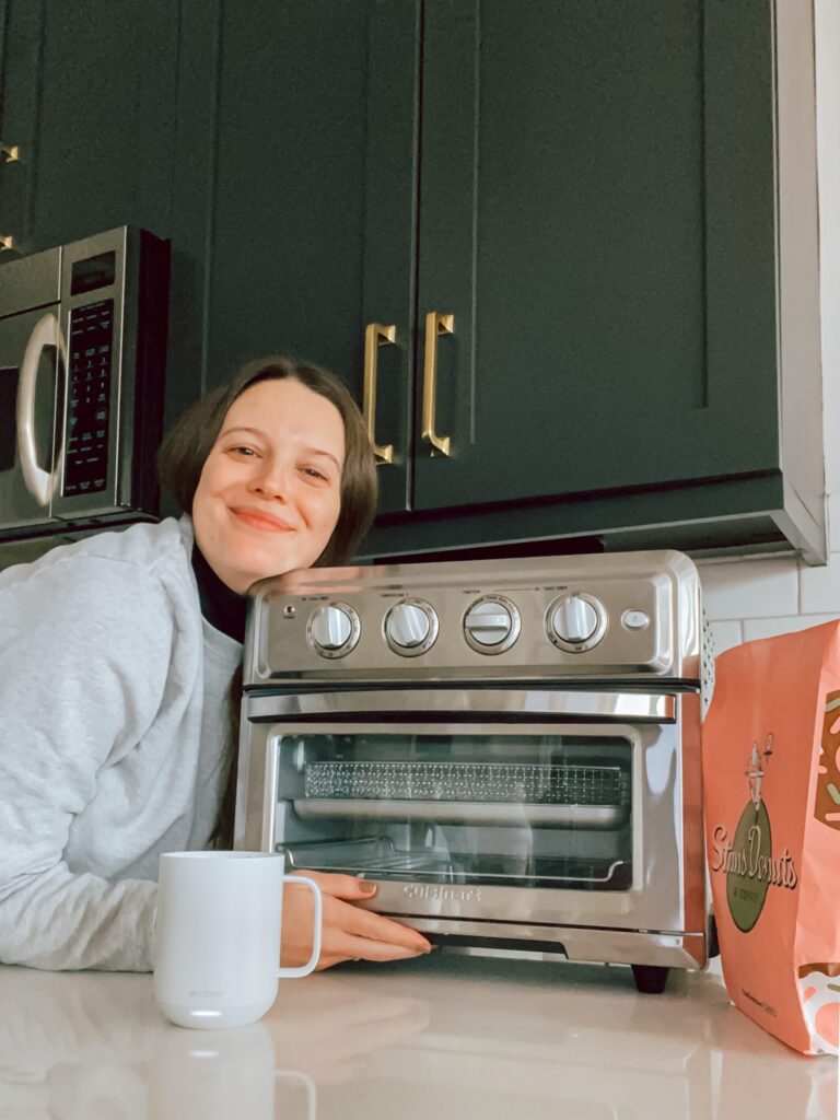 A happy family in the kitchen using the Cuisinart Air Fryer Toaster Oven