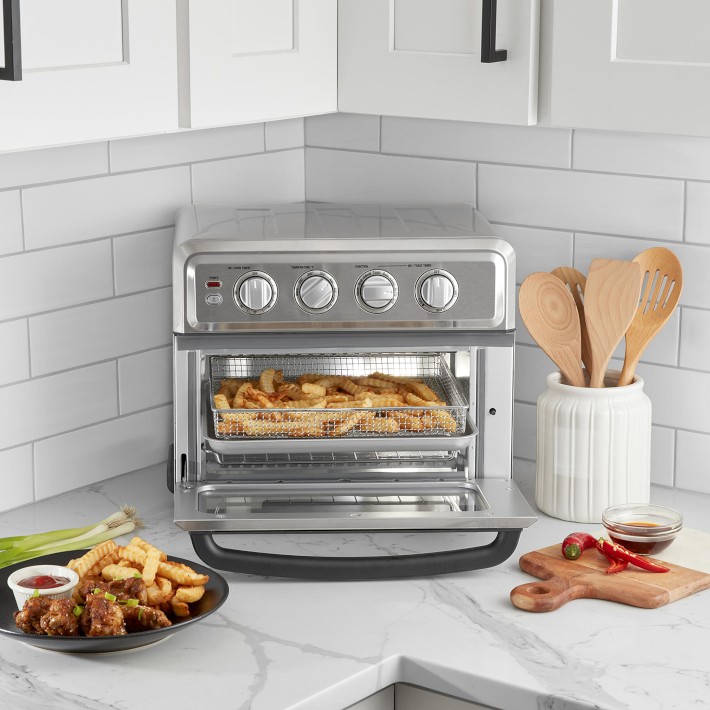 Front view of the Cuisinart Air Fryer Toaster Oven with Grill showing its stainless steel design and control dials."