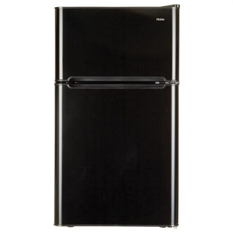 Haier 3.2 Cubic Feet Mini Fridge with Freezer in a small apartment kitchen