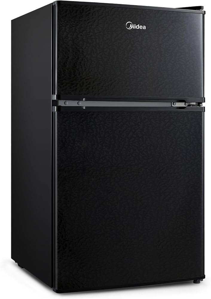 Midea WHD-113FB1 Double Door Mini Fridge with a freezer in a cozy apartment kitchen