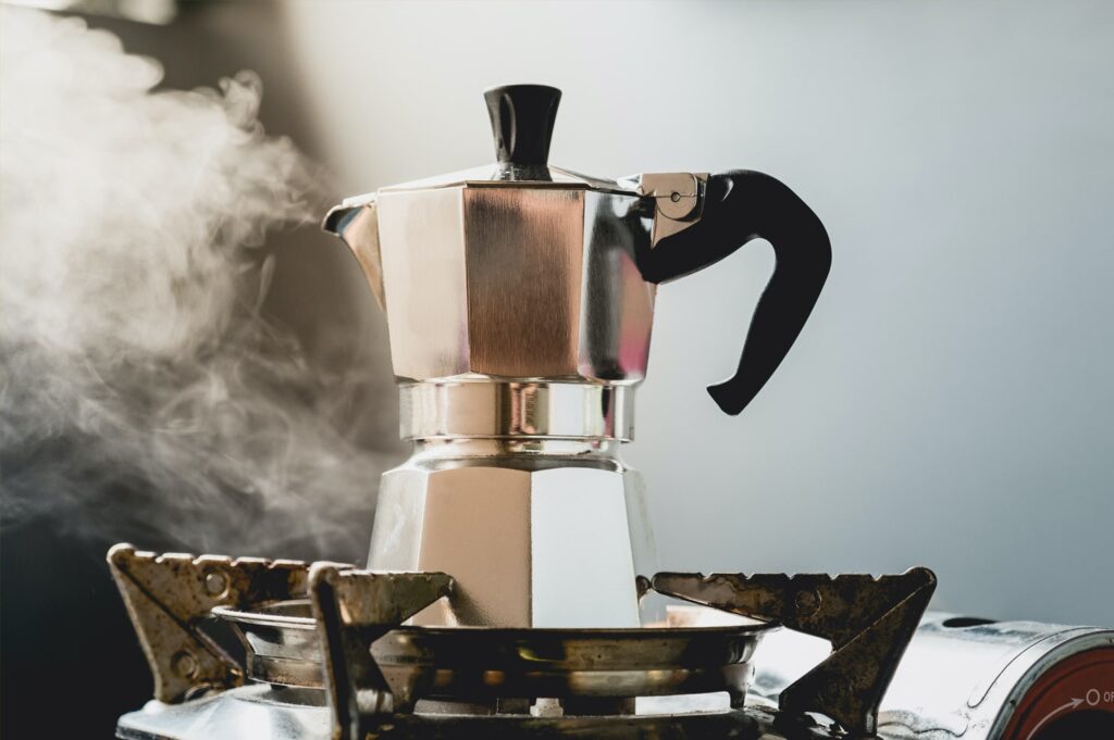 Italian Moka Pot Coffee Maker on a Stovetop Brewing Fresh Espresso