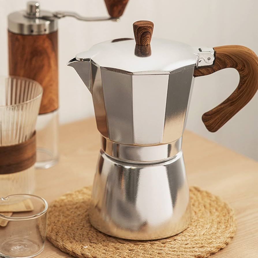  Italian Moka Pot Coffee Maker on a Stovetop Brewing Fresh Espresso

